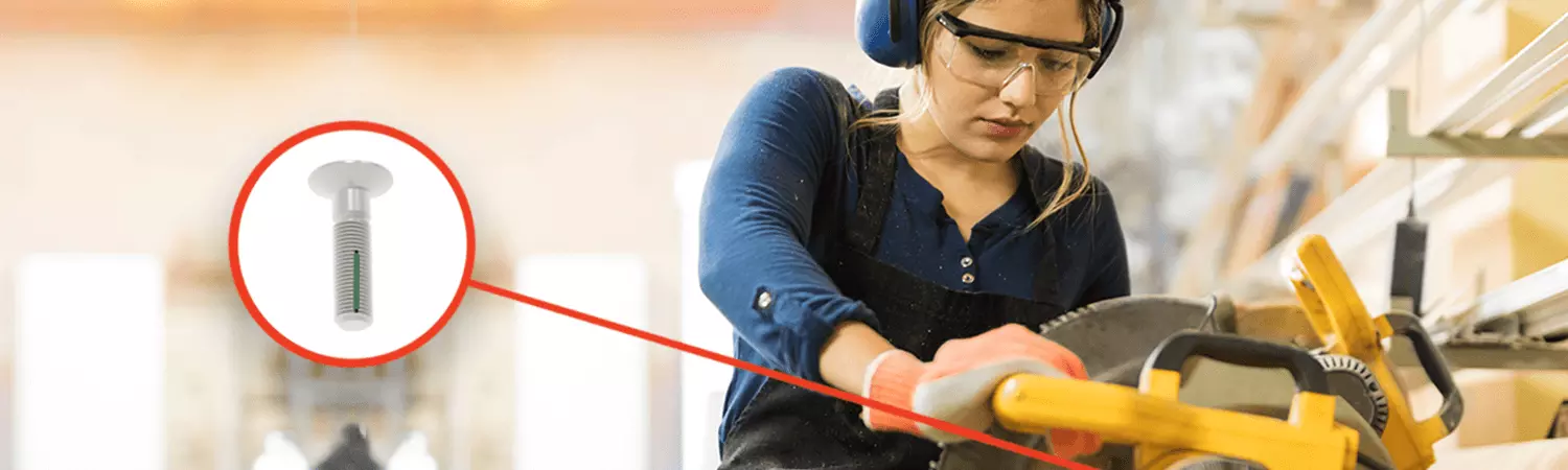 Patched screw in table saw with woman in protective goggles